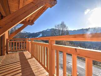 Enjoy breathtaking mountain views from this charming balcony.