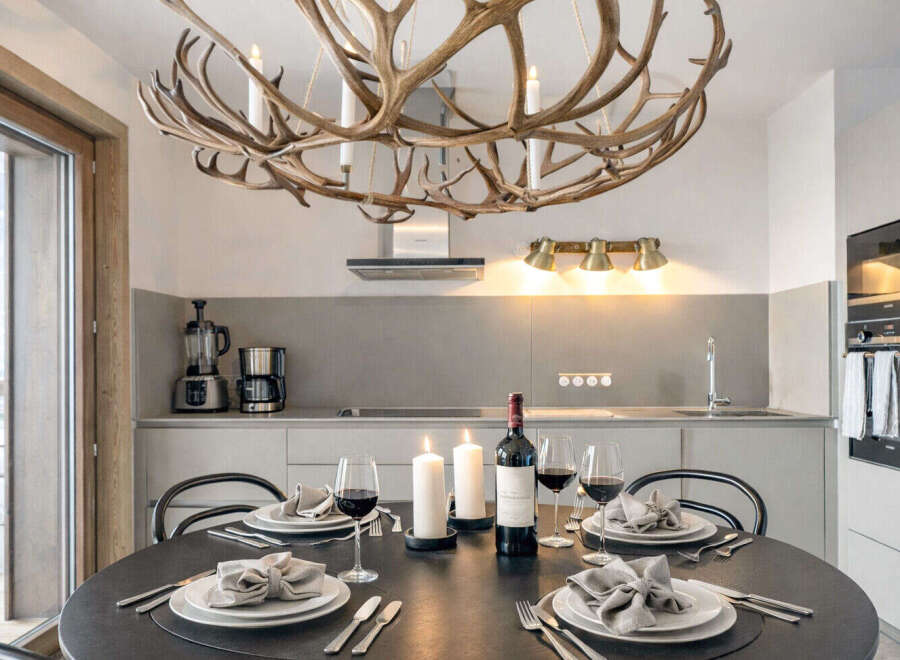 Experience luxury living in this stunning property, featuring a beautifully designed dining area.