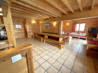 Step into this charming chalet, boasting a warm and inviting interior.