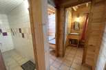 Discover the charm of this cozy property, featuring a well-designed bathroom with tiled walls and a separate shower area.