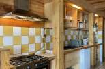 This charming kitchen features a rustic design with wooden accents and a modern touch.