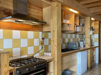 This charming kitchen features a rustic design with wooden accents and a modern touch.