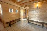 Step into this inviting space, featuring warm wooden walls and a cozy atmosphere.