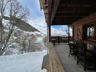 Enjoy breathtaking mountain views from this charming chalet.