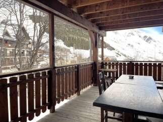 Enjoy breathtaking mountain views from this charming balcony.