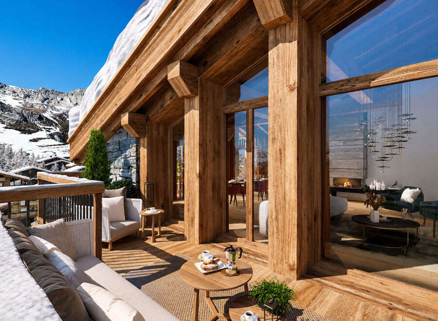 Experience luxury mountain living in this stunning chalet, featuring expansive wooden beams and floor-to-ceiling windows that offer breathtaking alpine views.