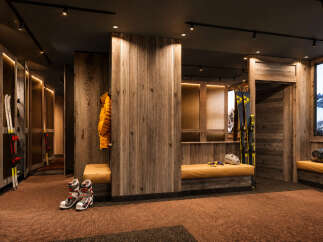 Experience the ultimate ski lodge ambiance with this beautifully designed ski room.