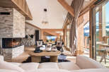 Experience the epitome of luxury living in this stunning property, boasting a cozy fireplace and elegant wooden accents throughout.