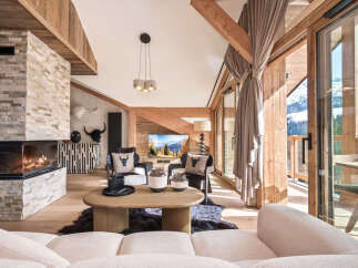 Experience the epitome of luxury living in this stunning property, boasting a cozy fireplace and elegant wooden accents throughout.