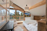 Experience the ultimate mountain retreat in this stunning bedroom.