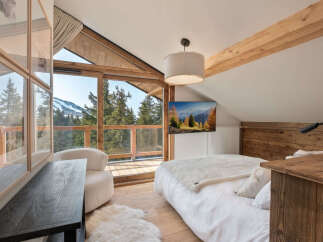 Experience the ultimate mountain retreat in this stunning bedroom.