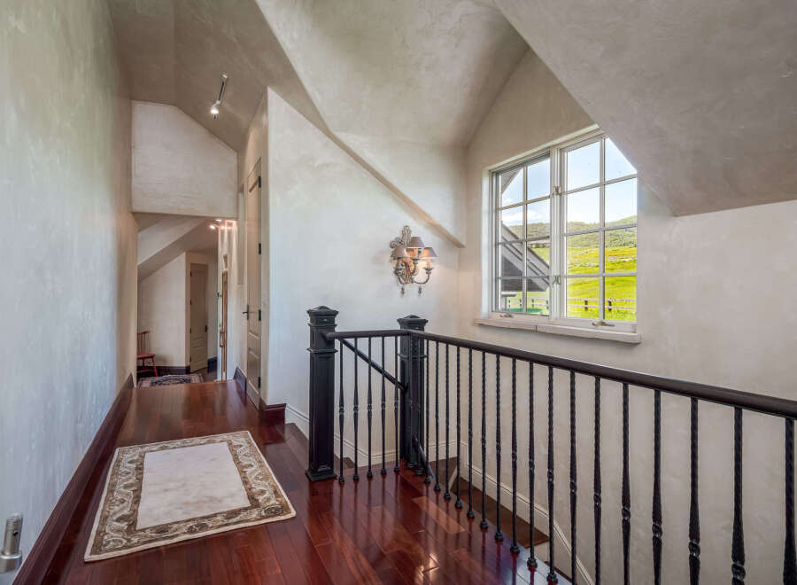 This stunning hallway showcases exquisite architectural details and luxurious finishes.