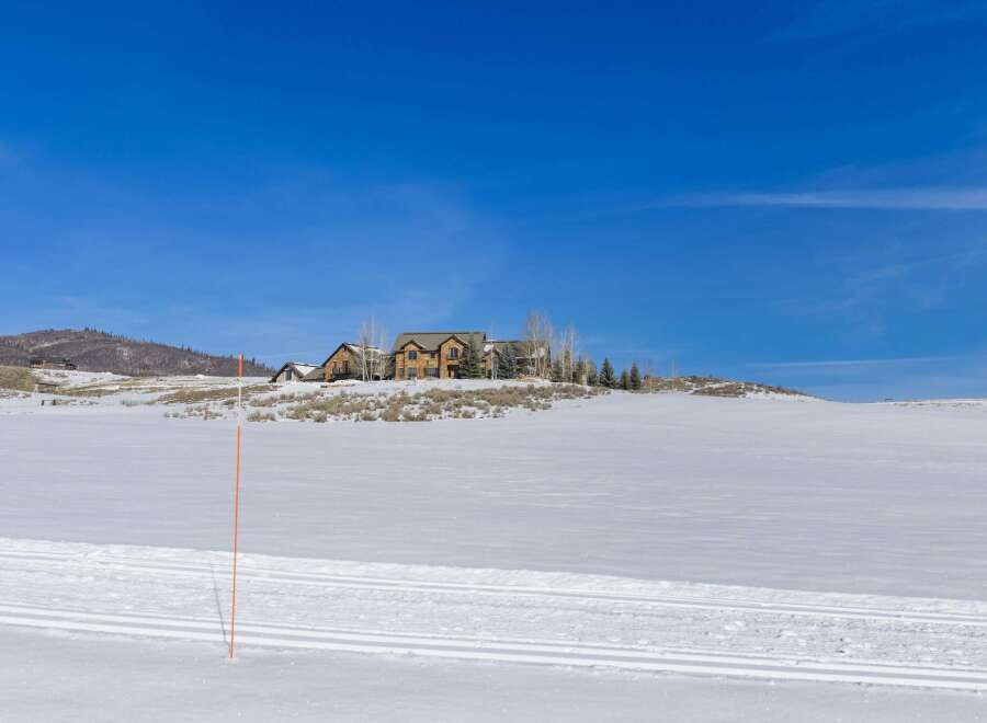 Discover a stunning property nestled in a winter wonderland, offering breathtaking views and unparalleled privacy.