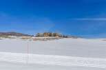 Discover a stunning property nestled in a winter wonderland, offering breathtaking views and unparalleled privacy.