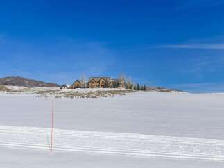 Discover a stunning property nestled in a winter wonderland, offering breathtaking views and unparalleled privacy.