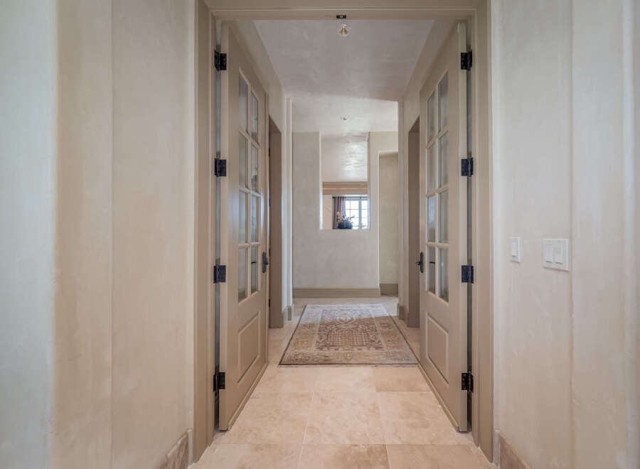 Step into luxury with this stunning hallway, showcasing elegant design and meticulous attention to detail.