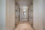 Step into luxury with this stunning hallway, showcasing elegant design and meticulous attention to detail.