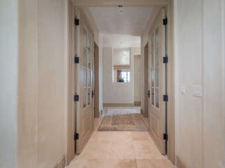 Step into luxury with this stunning hallway, showcasing elegant design and meticulous attention to detail.