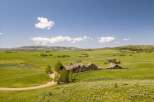 Experience luxury mountain living in this expansive estate, nestled amidst rolling green hills and breathtaking vistas.