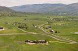 Discover this stunning property nestled in a picturesque valley, offering breathtaking mountain views and expansive green pastures.