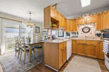 Step into this inviting kitchen, featuring warm wooden cabinetry and a functional layout.
