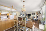 Step into this inviting home featuring a seamless blend of dining and living spaces.