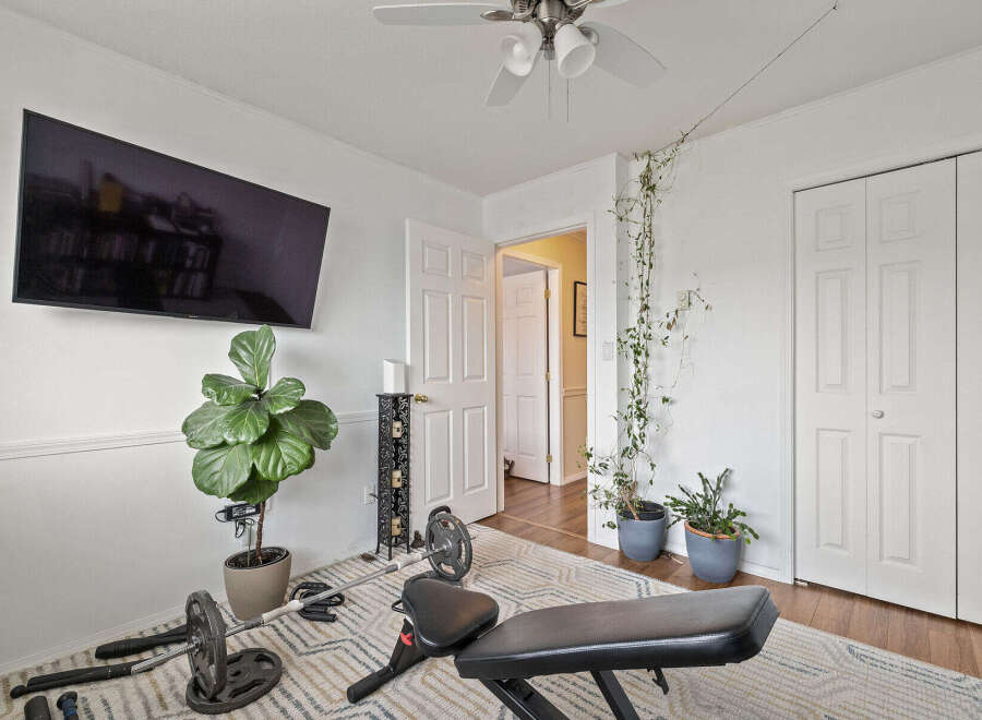 This home gym offers a versatile space for fitness enthusiasts.