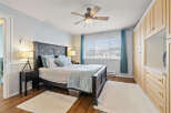 Step into this inviting bedroom, featuring a comfortable bed with stylish bedding and accent pillows.
