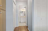 Step into this inviting home and discover a well-designed hallway leading to a bright bathroom.