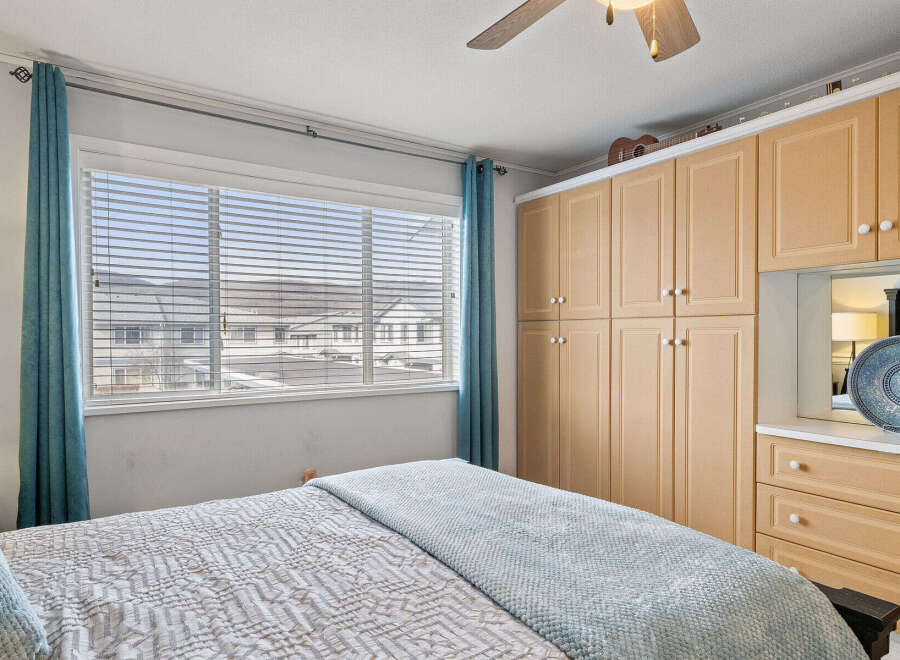 Step into this inviting bedroom, featuring a cozy bed and ample natural light.