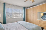 Step into this inviting bedroom, featuring a cozy bed and ample natural light.