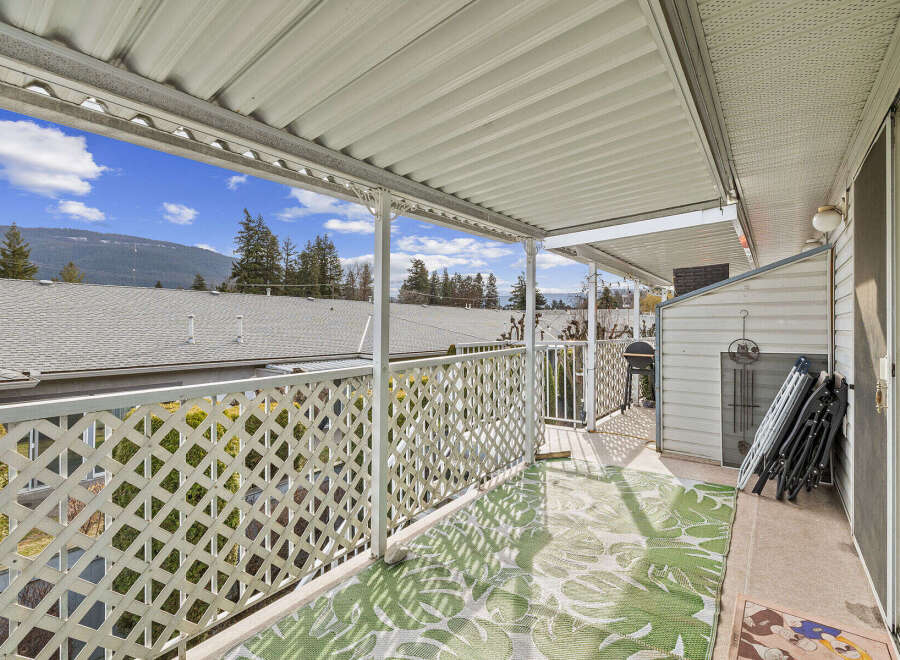 Enjoy the fresh air and stunning views from this charming outdoor space.