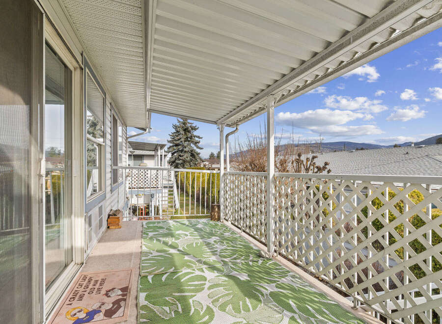 Enjoy the fresh air and stunning views from this charming balcony.