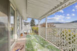 Enjoy the fresh air and stunning views from this charming balcony.