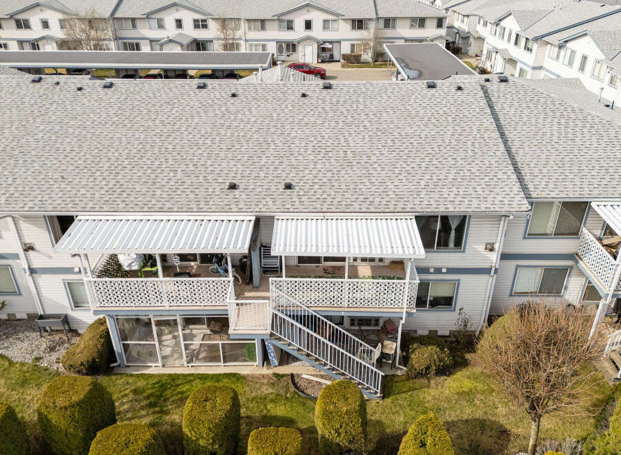 Discover this charming property featuring multiple units, each with its own balcony and awning, perfect for enjoying the outdoors.
