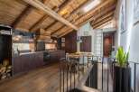 This stunning property boasts a rustic charm with its exposed wooden beams and warm, inviting atmosphere.