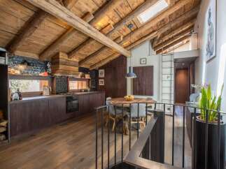 This stunning property boasts a rustic charm with its exposed wooden beams and warm, inviting atmosphere.