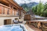 Escape to your own mountain retreat! This stunning property boasts a luxurious hot tub, perfect for relaxing after a day of exploring the surrounding natural beauty.