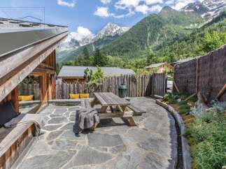 Escape to the mountains in this stunning property, featuring a beautiful outdoor patio perfect for enjoying the breathtaking views.