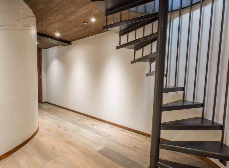 Discover the elegance of this stunning property featuring a unique spiral staircase.