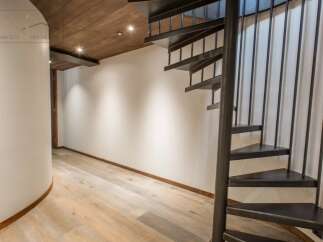 Discover the elegance of this stunning property featuring a unique spiral staircase.