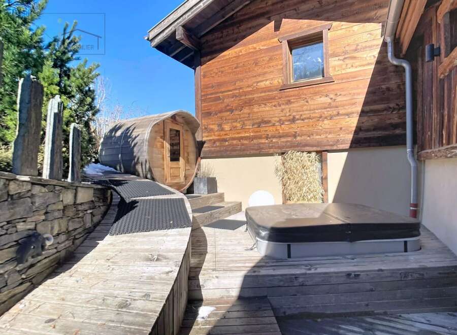 Discover the epitome of luxury living with this stunning property, featuring a private sauna and a relaxing hot tub.