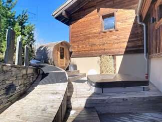 Discover the epitome of luxury living with this stunning property, featuring a private sauna and a relaxing hot tub.