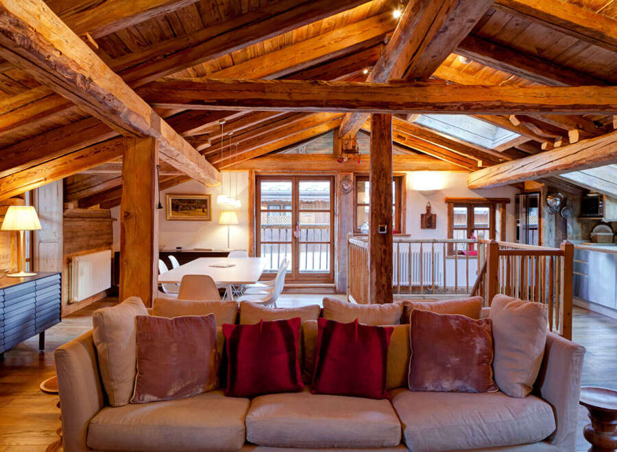 Experience the charm of this stunning property, featuring a rustic wooden ceiling and exposed beams that create a warm and inviting atmosphere.
