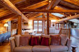 Experience the charm of this stunning property, featuring a rustic wooden ceiling and exposed beams that create a warm and inviting atmosphere.