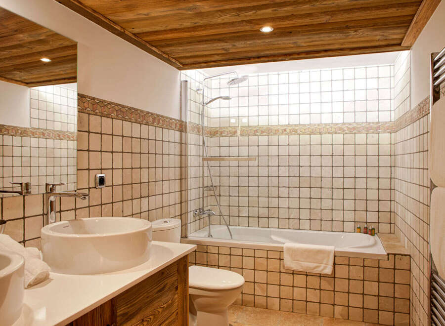 Step into luxury with this stunning bathroom featuring a sleek design and modern amenities.