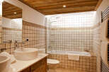 Step into luxury with this stunning bathroom featuring a sleek design and modern amenities.