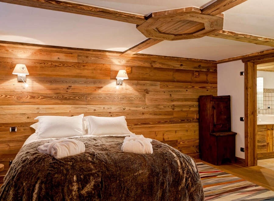 Experience rustic luxury in this stunning bedroom.