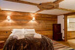 Experience rustic luxury in this stunning bedroom.
