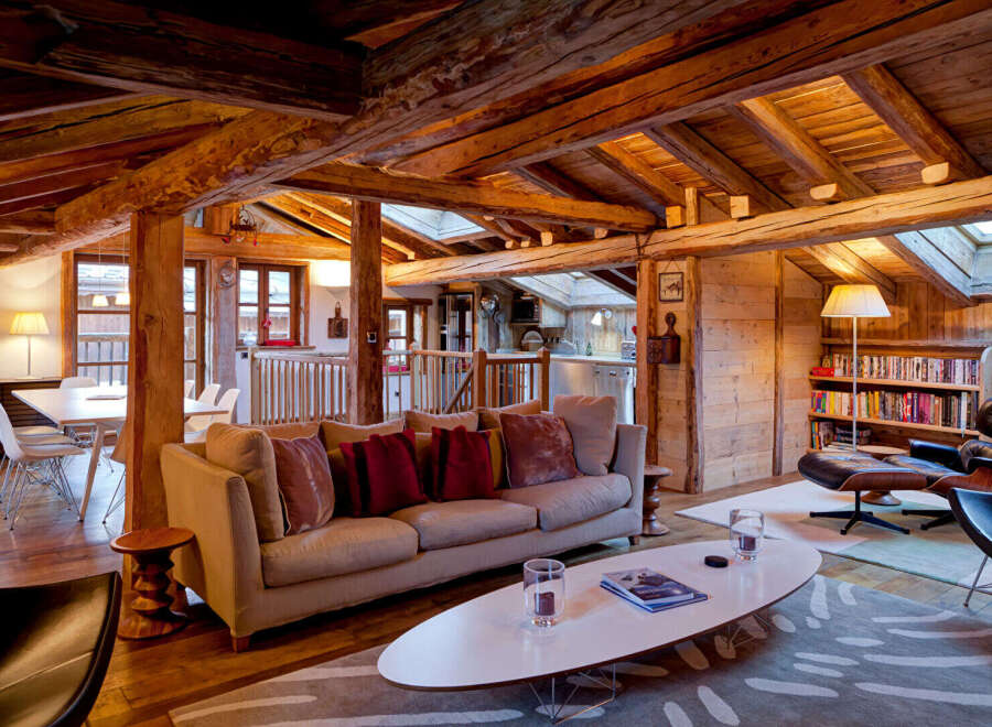 This stunning property boasts a rustic charm with its exposed wooden beams and cozy interior.